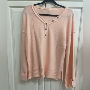 Peachy colored sweater, size medium